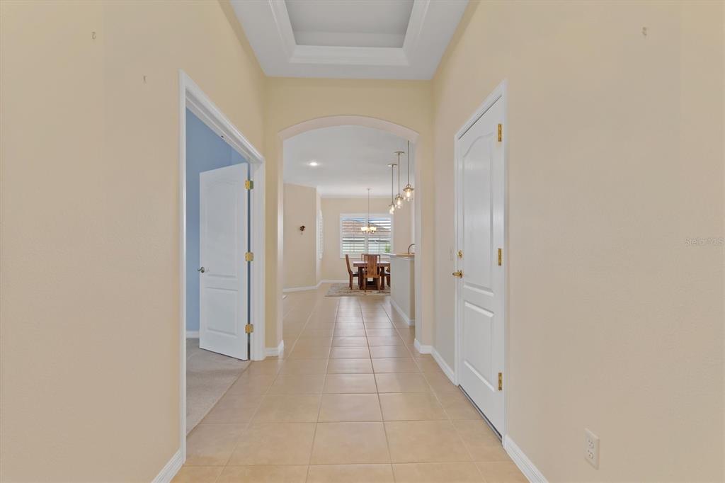 Foyer with coffered ceiling.  Immaculate and pristine.