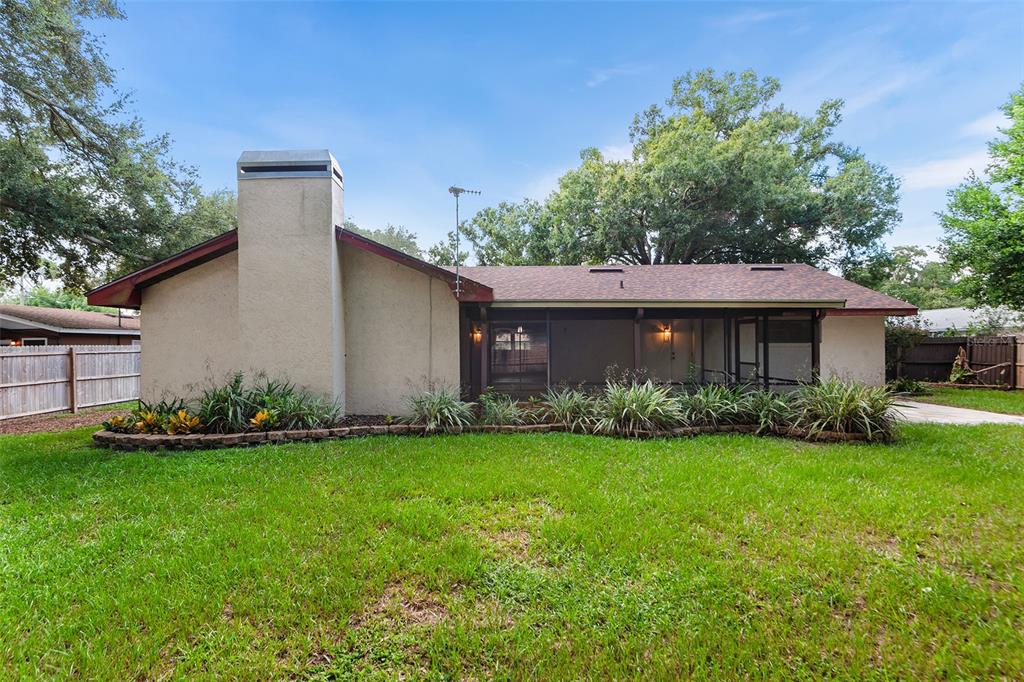 Rear view of home & large screened patio