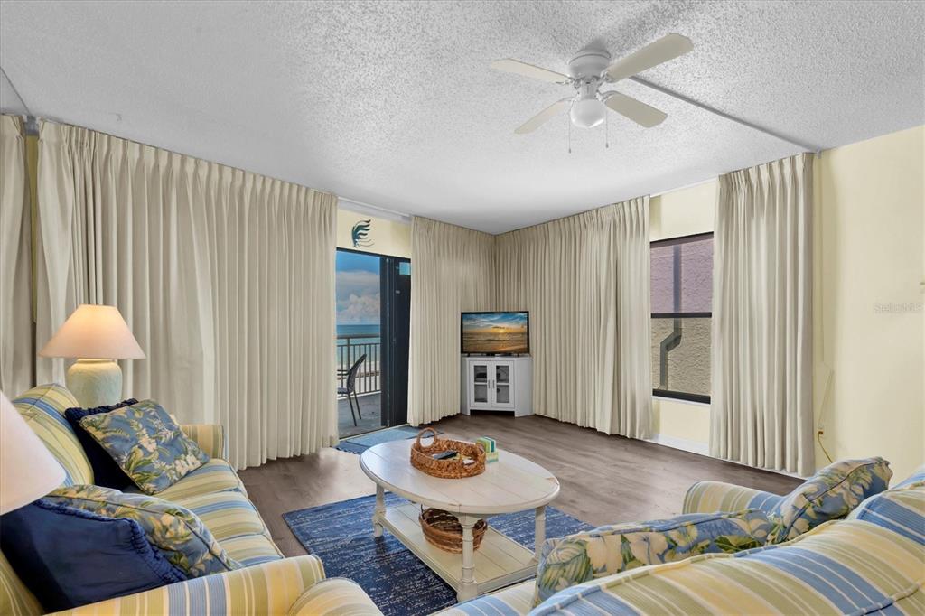 Spacious living area with balcony access.