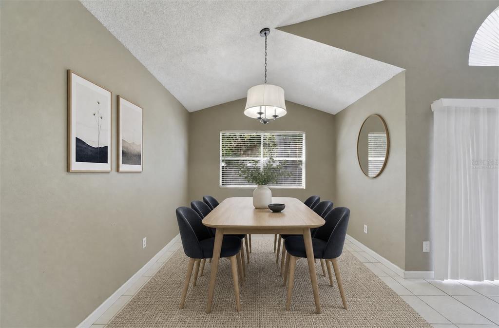 Nearby, the Dining Room enjoys a pleasant VIEW OF THE BACKYARD, and provides a comfortable setting for meals and gatherings. Virtually Staged