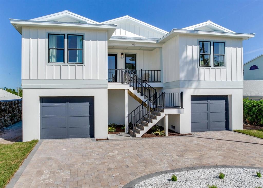 Photos show a completed home in Indian Rocks Beach for illustration purposes only. Actual home, finishes, selections, and features may vary.