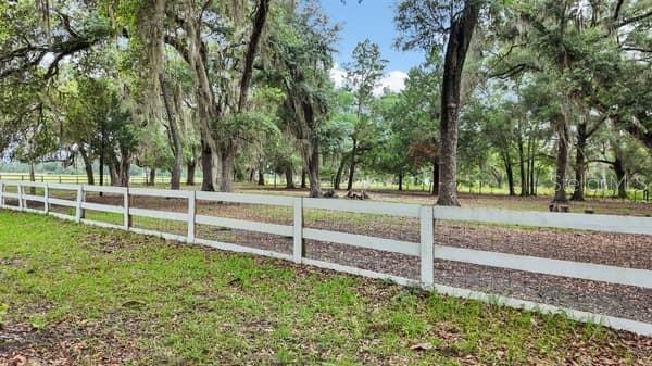 front white board fence over field fence