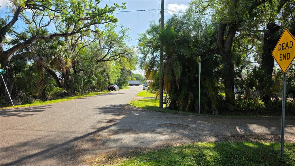 Looking East down 23rd Ave, back towards 50th Street.This is the back entrance to Lot A & also the entrance to Lot B.Turn South into DEAD END 49th Street.