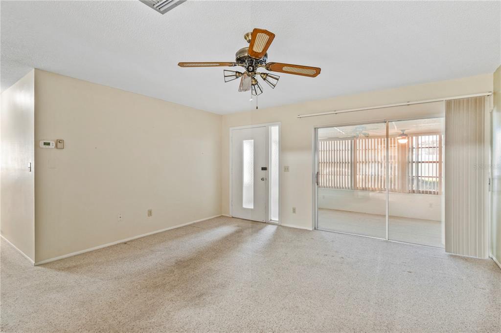 Living room with sliders to Florida room