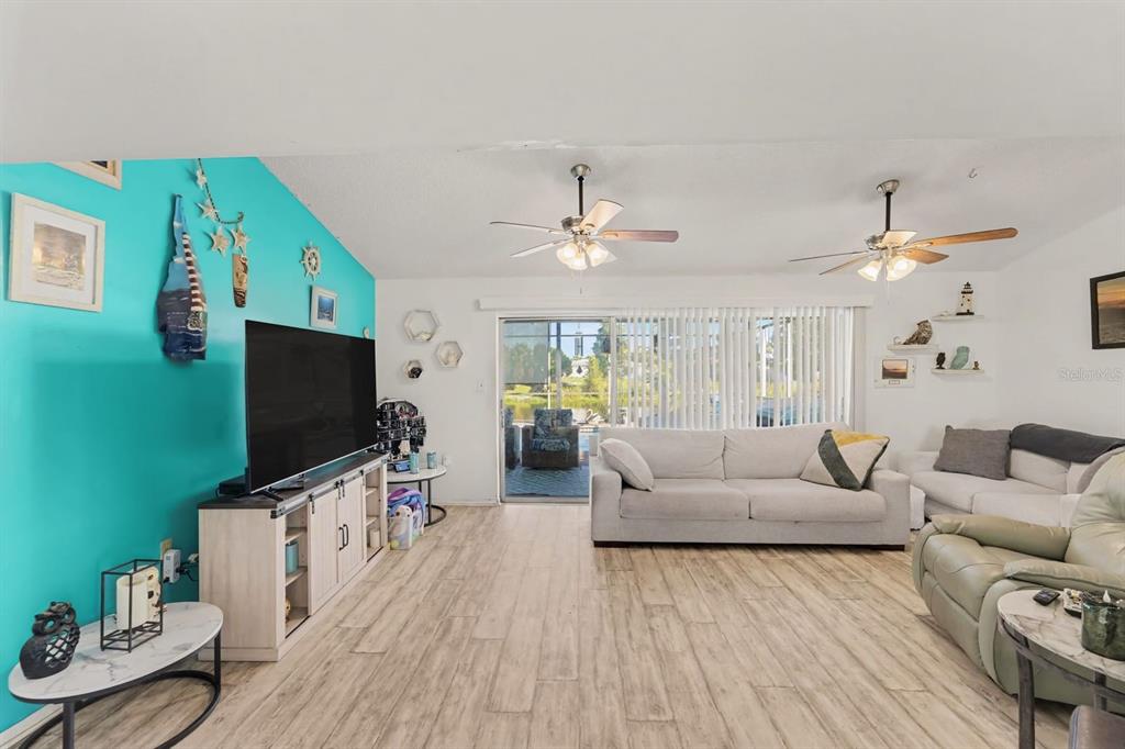 Expansive living space with multiple seating areas and water views