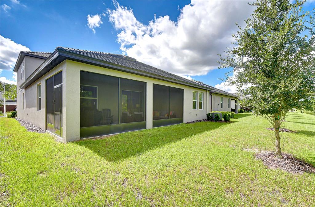 Spacious screened lanai creates an inviting extension of the home's living space for relaxing and entertaining.