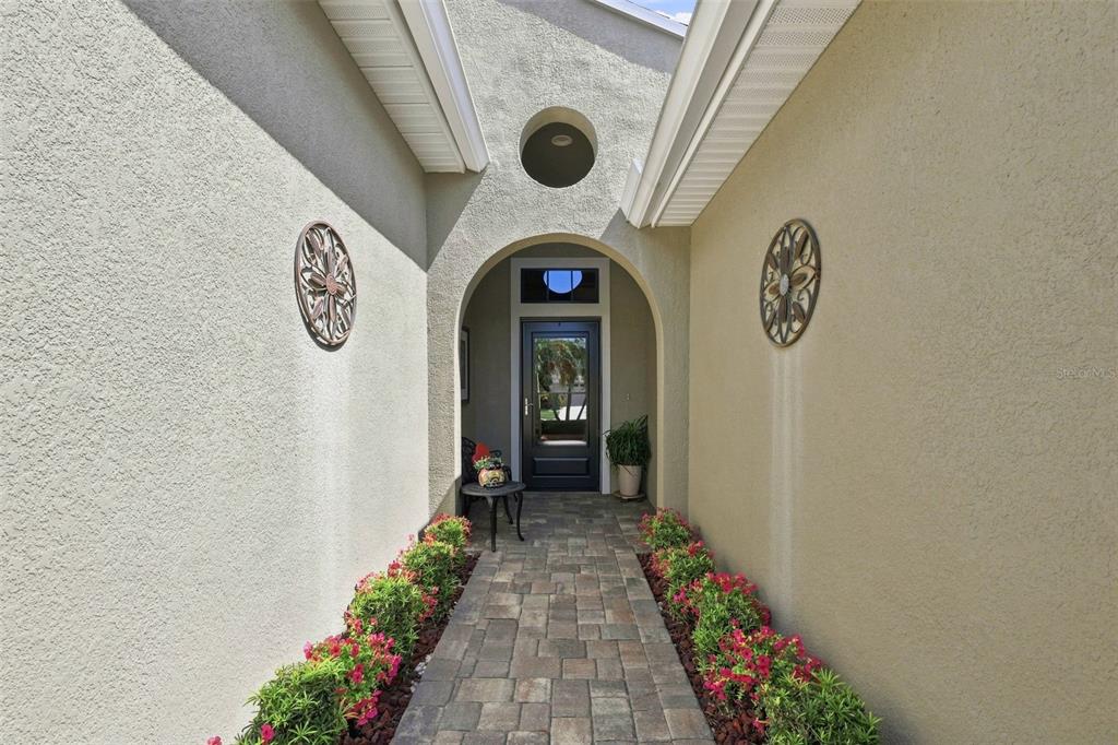 INTRODUCING THE FRONT ENTRY PAVER WALKWAY AND STORM DOOR.