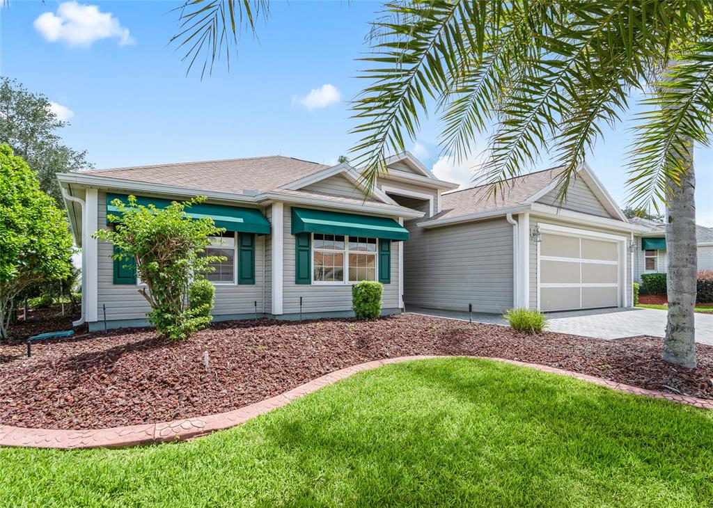 The spacious CORNER LOT showcases the home’s attractive landscaping, architectural details and welcoming curb appeal.