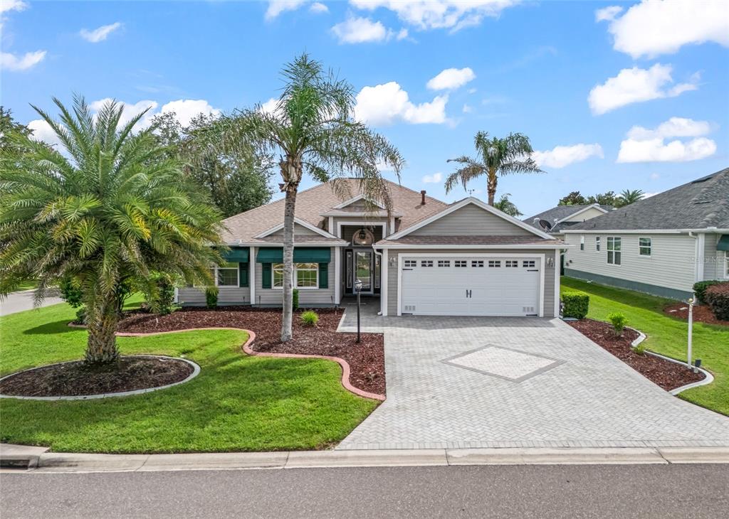 Beautiful Expanded Hawthorne/Oleander on a desirable CORNER LOT in the Village of Piedmont, featuring mature tropical landscaping, an attractive paver driveway and a NEW ROOF in 2024.