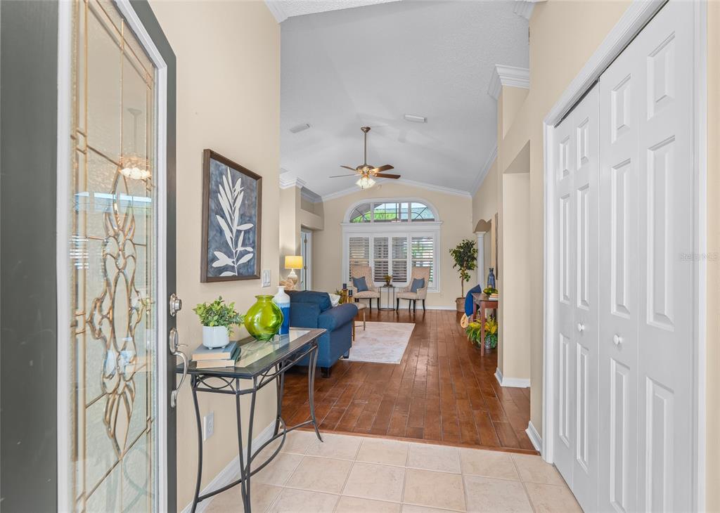 Step inside to a bright and spacious interior with beautiful wood flooring, soaring ceilings, decorative architectural details and CROWN MOLDING throughout.