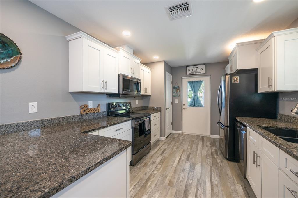 Spacious kitchen with recessed lighting