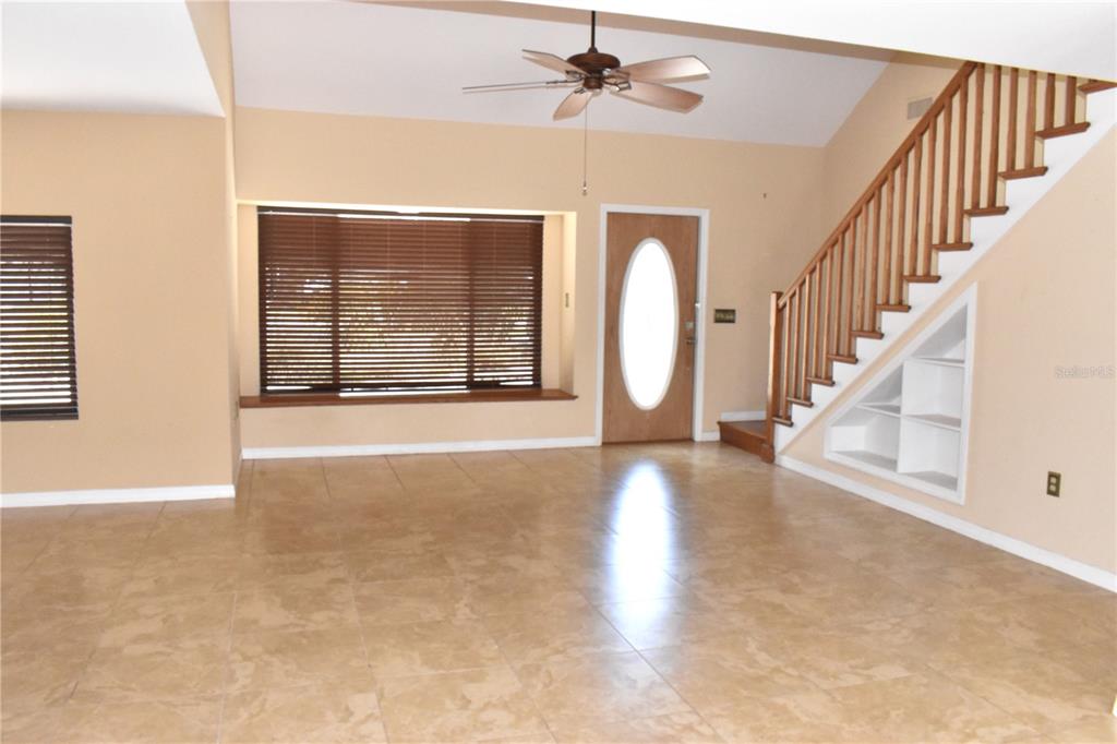 Living Room with Stairs to 2nd floor Suite