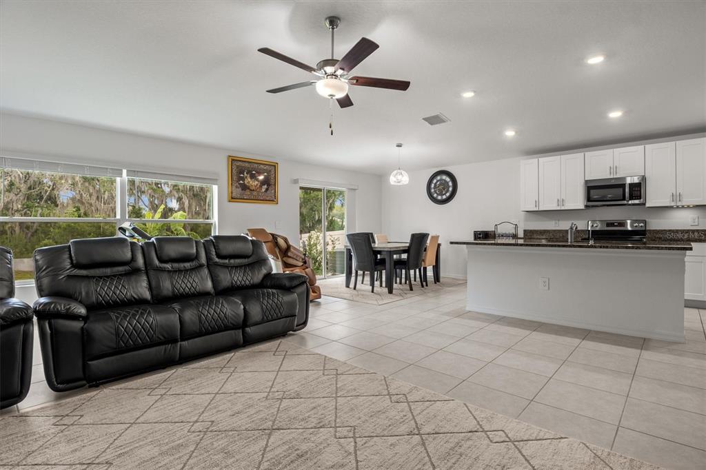 View of living room, dining room and kitchen