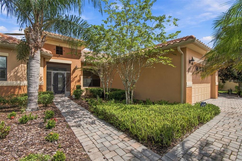 Custom Landscaping and screened front entryway