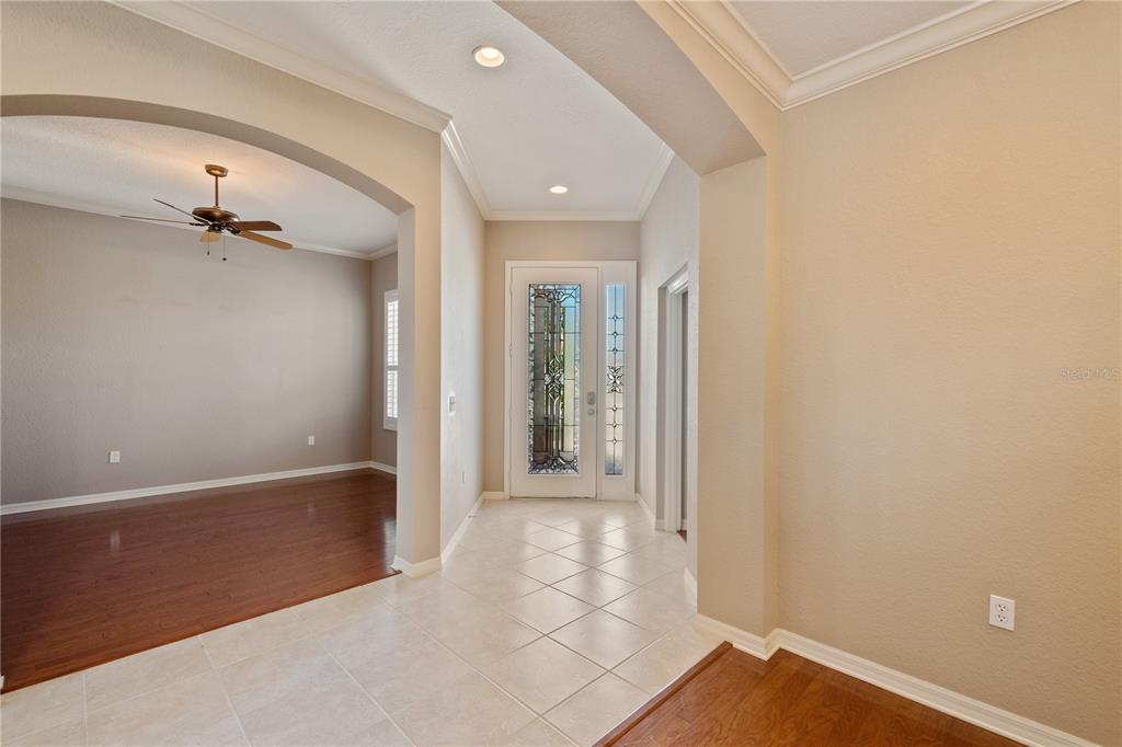The home features extensive tile flooring with some rooms boasting engineered wood flooring.