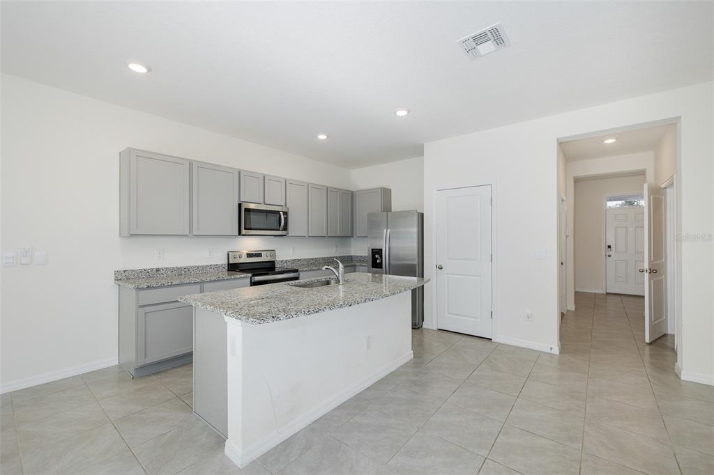 Large Kitchen with Walk In Pantry and Stainless Steel Appliances
