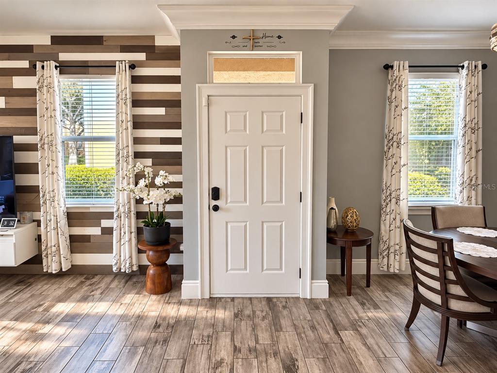 Welcoming entryway with stylish wood-look flooring.