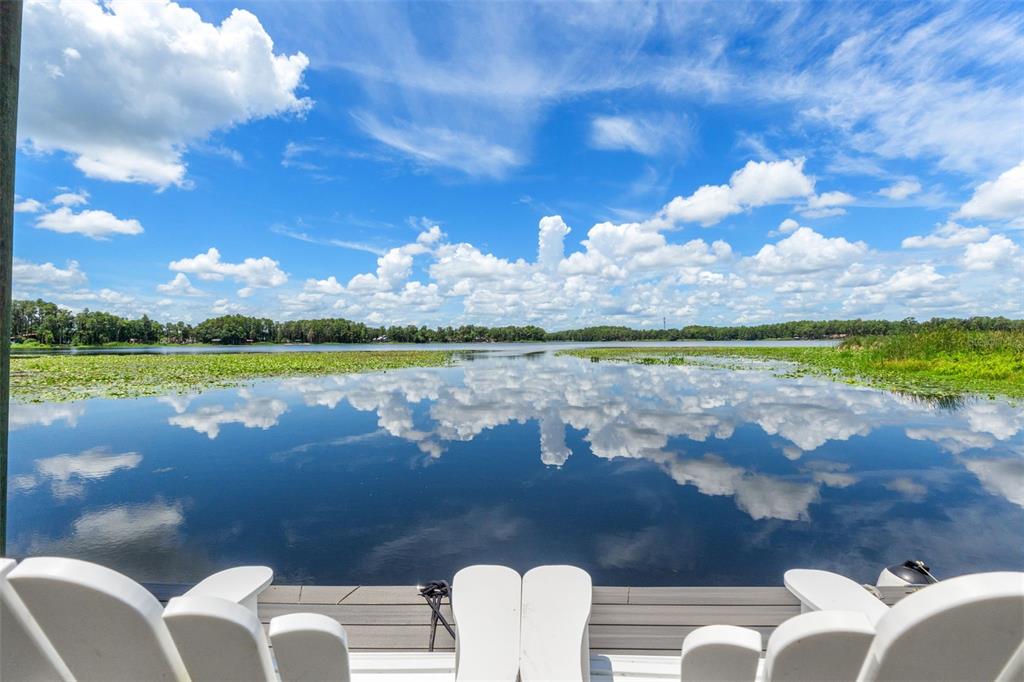 Your front-row seat to the King Lake lifestyle — Relax at your private waterfront and take in expansive lake views, brilliant Florida skies, and peaceful surroundings—the perfect setting for morning coffee, sunset cocktails, and days spent on the water