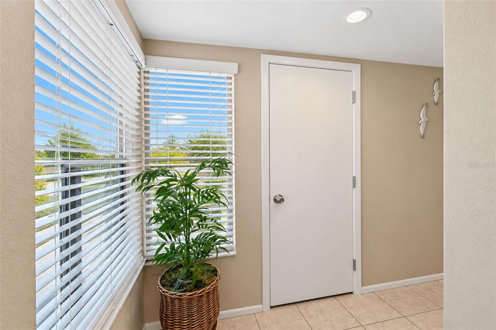 The front entry has tiled flooring and natural light.