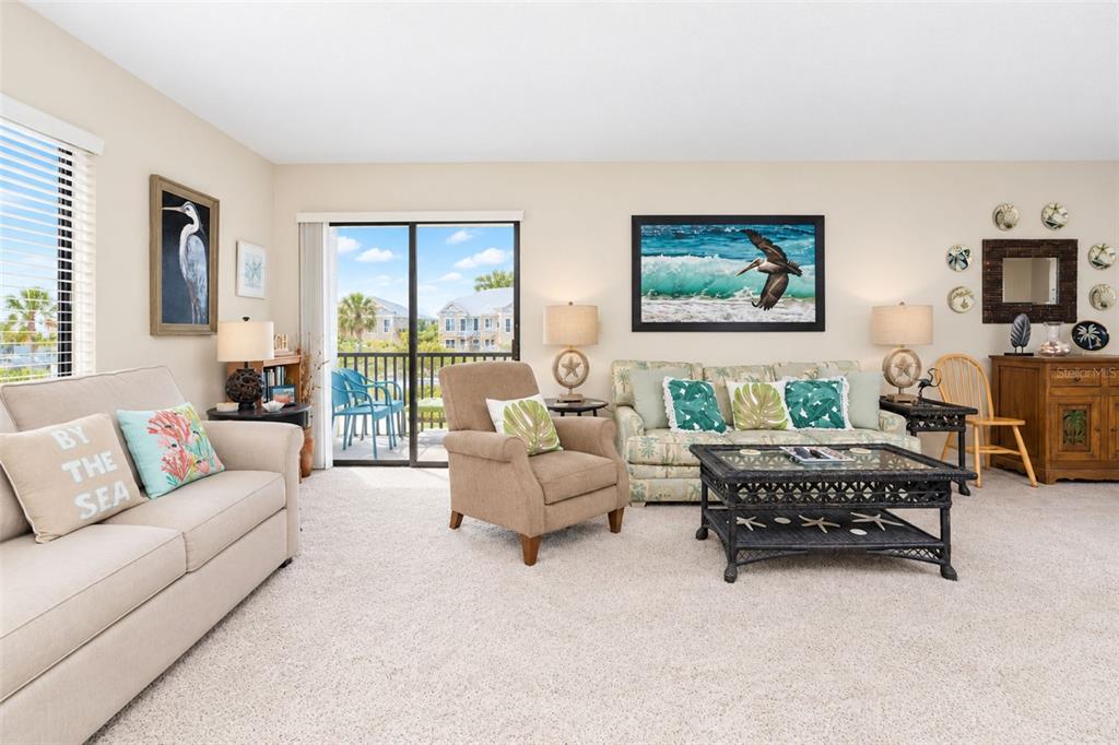 Another view of the light, bright and neutral living area.
