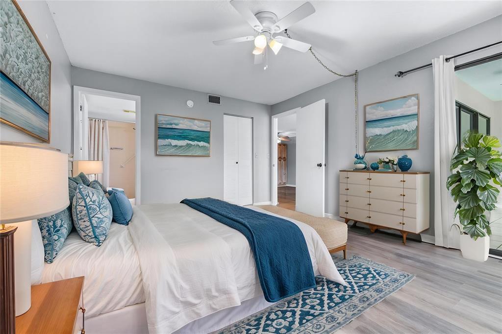 Virtually staged primary suite with en suite bathroom and walk-in closet