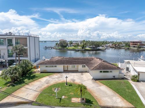 Expansive waterfront views showcase the property's exceptional setting & direct connection to the water.