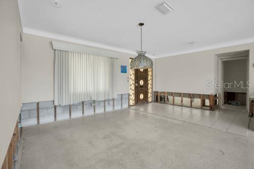 Generous dining area flows seamlessly into the living room and steps effortlessly out to the spectacular waterfront.
