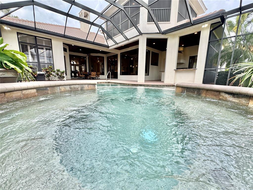 View from behind the hot tub looking towards the rear of the home