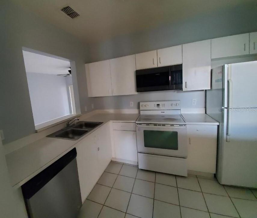 Property for sale at 13215 VILLA VISTA DRIVE UNIT 203, ORLANDO, FL, 32824