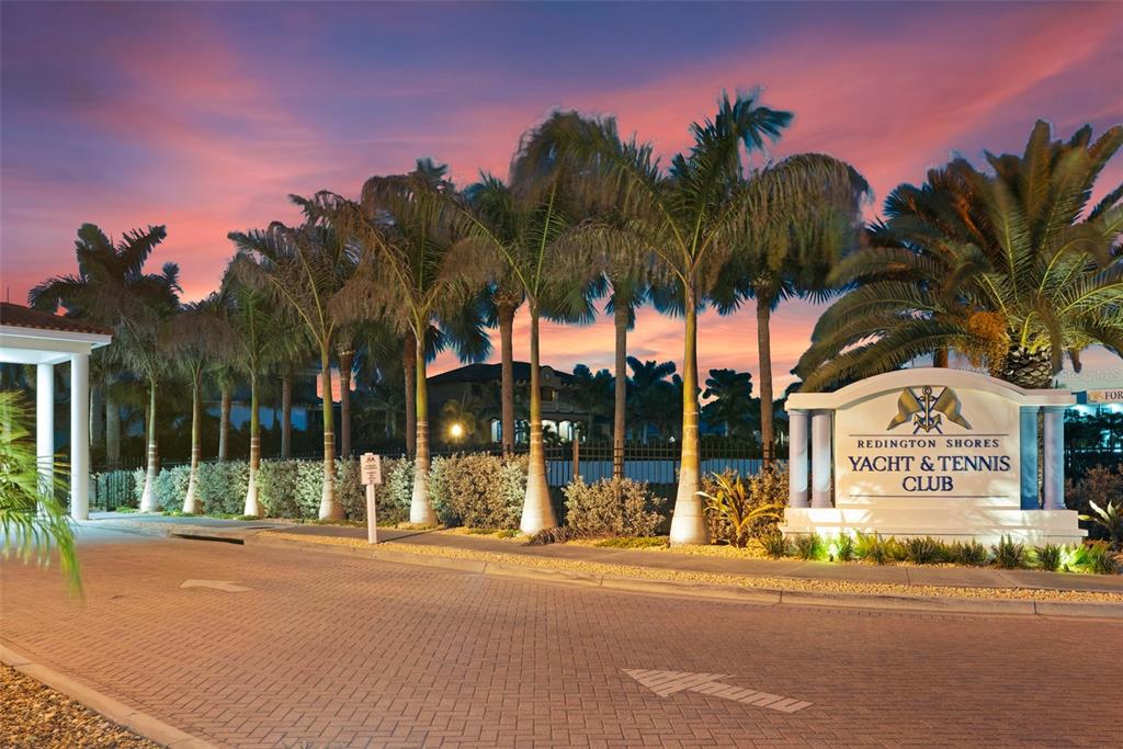 Redington Shores Yacht Tennis club Grand entryway, fully gated, gorgeously landscape and lit for nighttime strolls