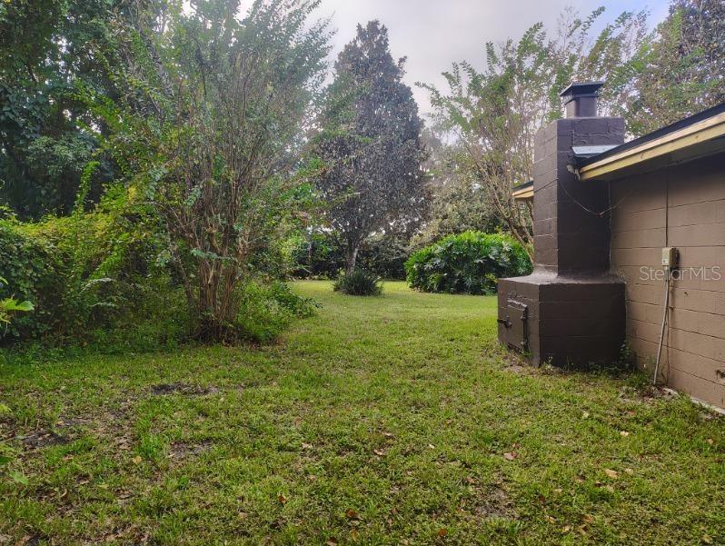 East side of property from back yard towards front yard.