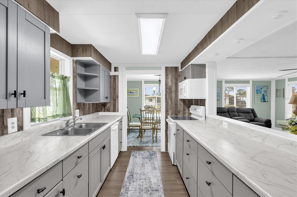 Fully remodeled kitchen with new cabinets, countertops, and sink.