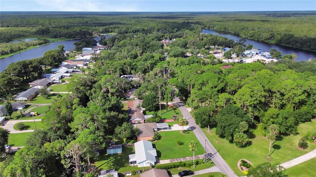 Aerial views of the River to the right and Lake Beresford near Hontoon Island on the left a very short distance from this home’s dock