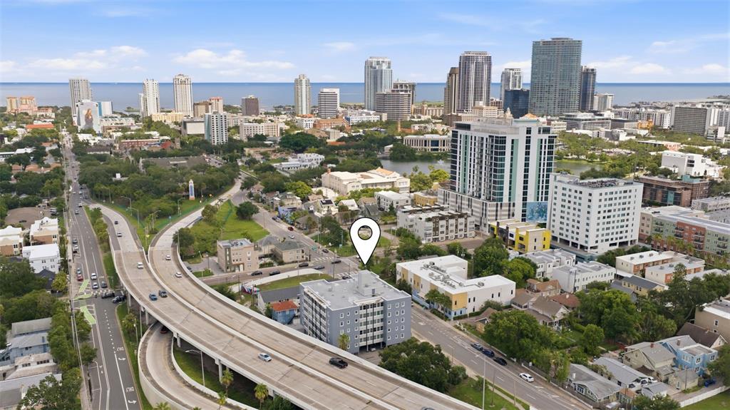 Aerial perspective showcasing the nearby Downtown St. Petersburg skyline and surrounding neighborhood.