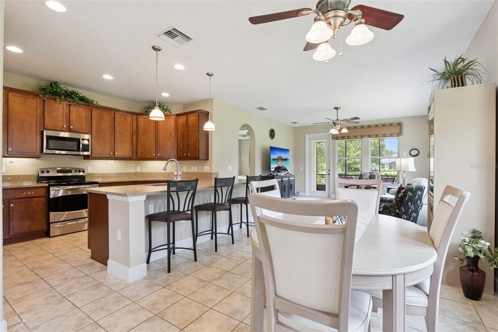 View of the Dining & Kitchen areas w/ a breakfast bar