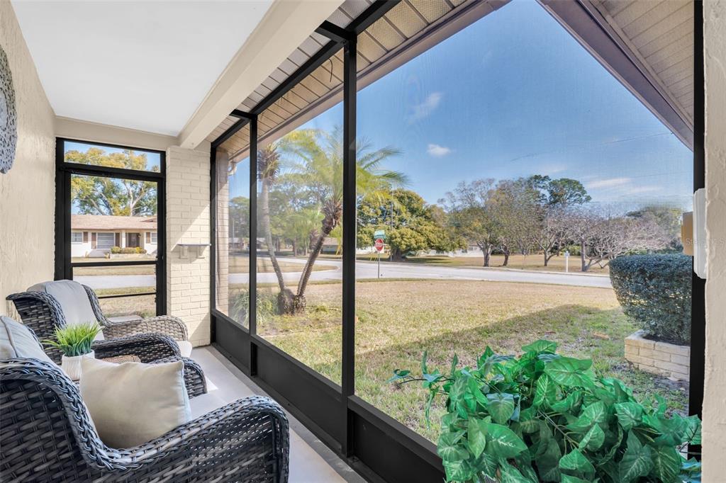 Front screened lanai for year-round enjoyment and allows you to leave the front door open for a breeze inside~