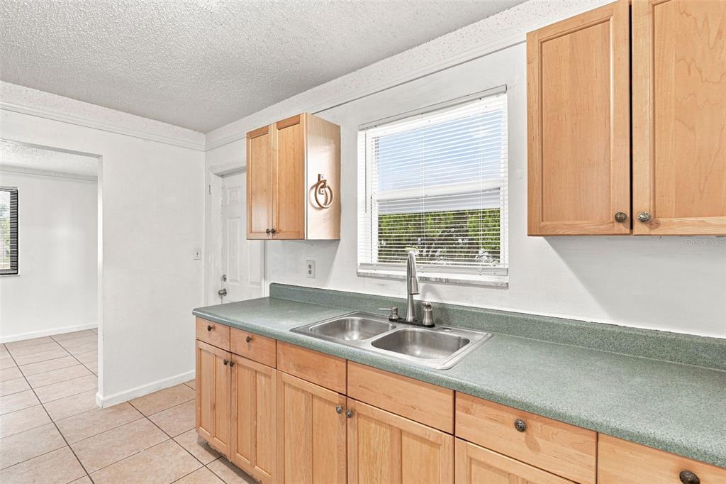 Wide Galley Kitchen with Double Basin Sink and Window View