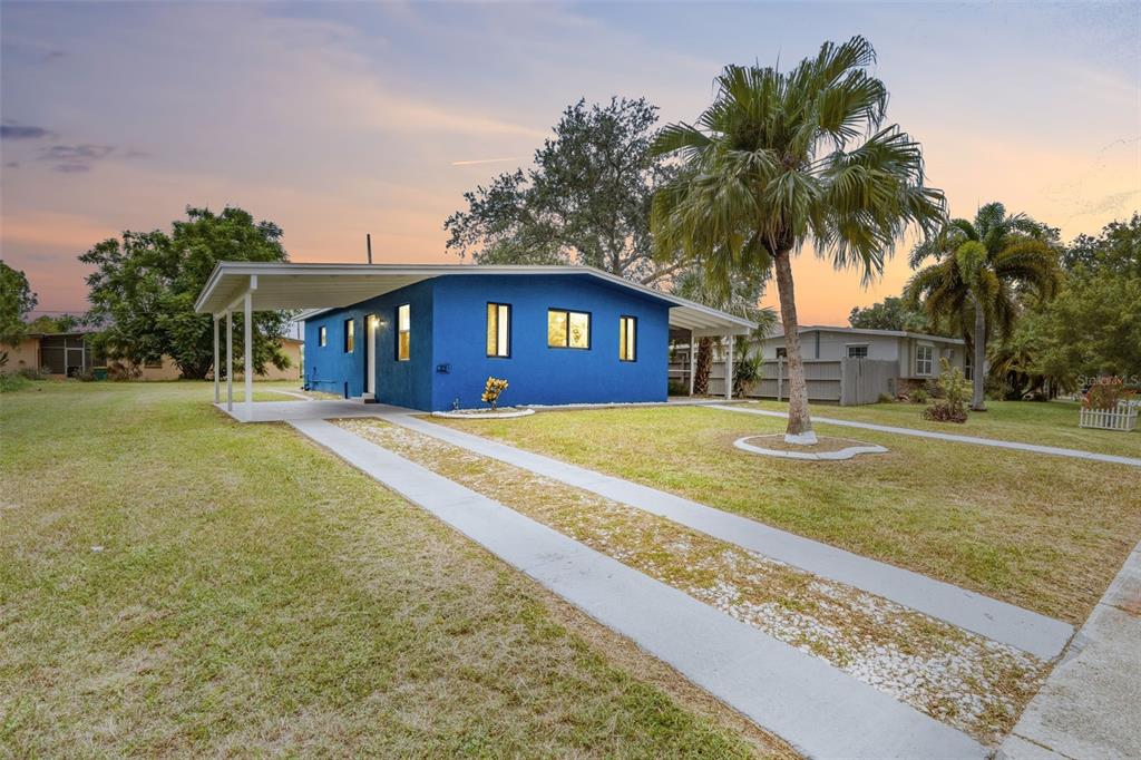 Charming Cottage Style Home with Mature Palms & Extra Long Carport