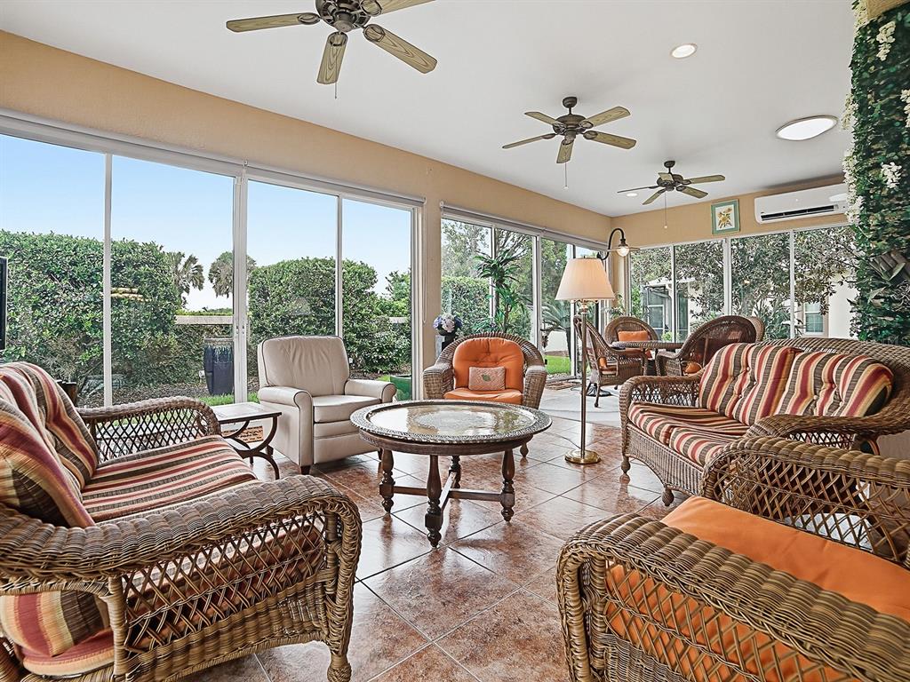 SPECTACULAR SUNROOM WITH LOVELY TILE FLOORING, A MINI-SPLIT FOR CLIMATE CONTROL AND COMPLETE PRIVACY!