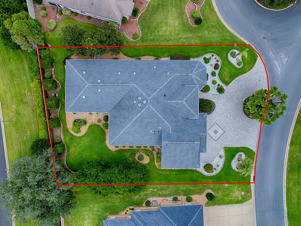 AERIAL VIEW! PLENTY OF PARKING WITH A PAVED CIRCLE DRIVEWAY, BEAUTIFULLY LANDSCAPED AROUND THE ENTIRE HOME PROVIDING COMPLETE PRIVACY!