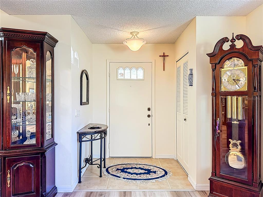 Front entrance and foyer lead into the living and dining room.