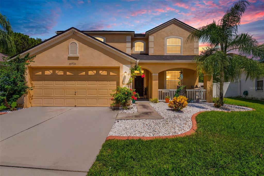 Lovely Curb Appeal With Extended Driveway, Curbing, Fully Fenced and a Front Porch