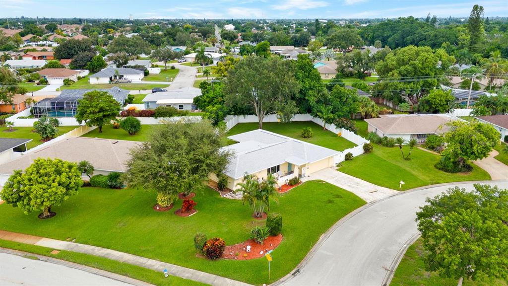 Aerial View of corner lot and large enclosed backyard