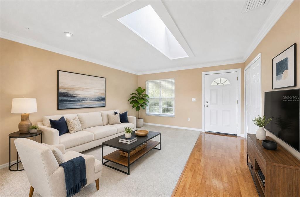 Skylight in the living area adds natural light. Virtually Staged.