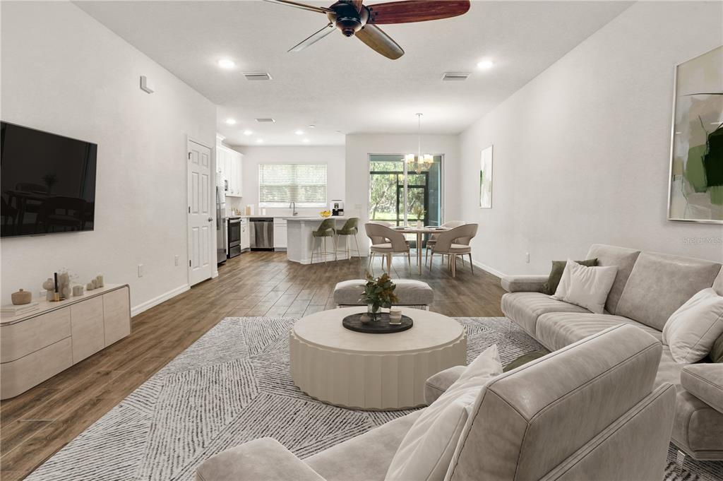 Naturally Lit Living, tall ceilings and recessed lighting throughout
