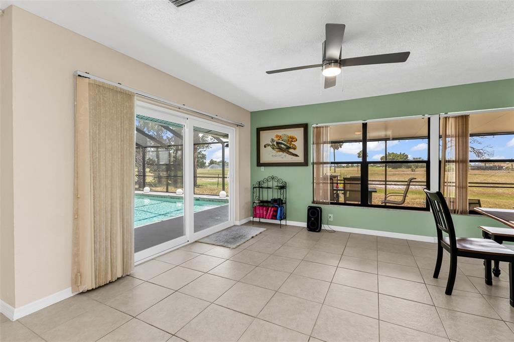 Dining Room with slider to the pool deck.