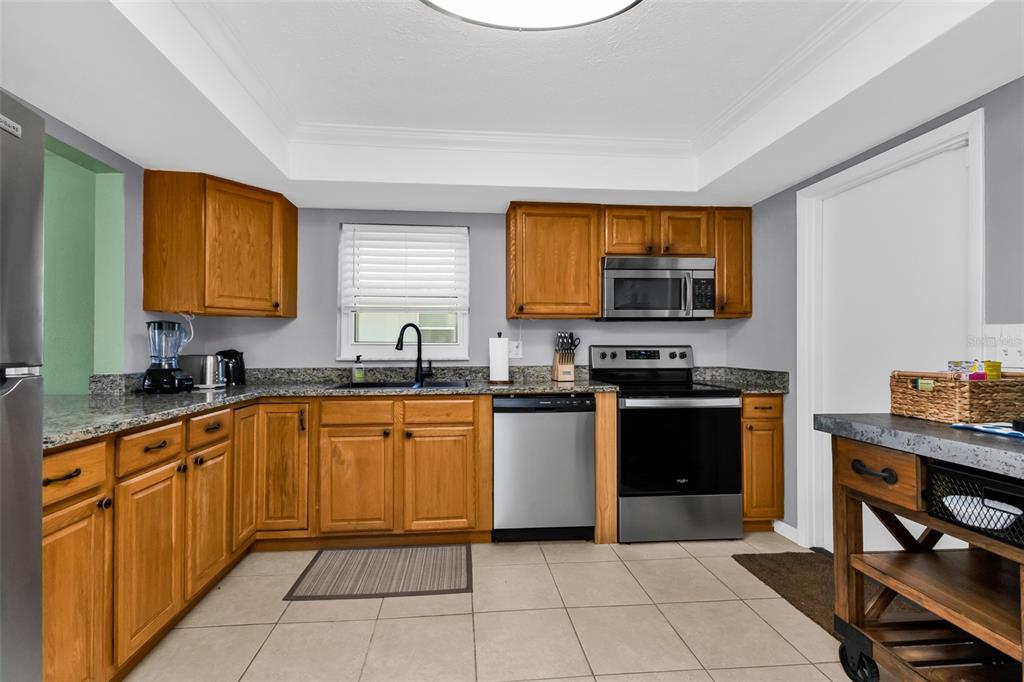 Full kitchen with plenty of storage.