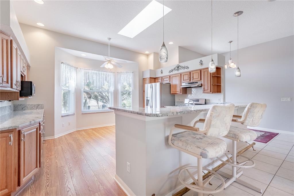 Kitchen with brass footrest at counter