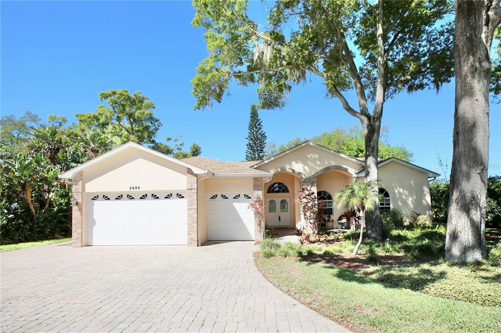 Lovely Roundtop windows and multiple roof lines adorned home with such attention to detail
