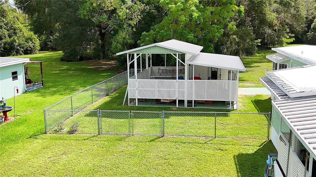 with fenced yard and RV port...